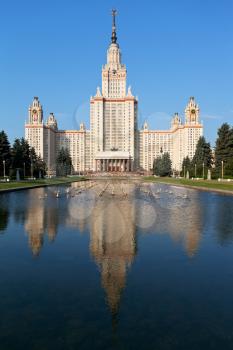 main building of Moscow State University and fountain pond in summer day