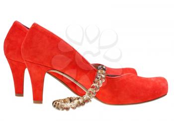 red high heel pump shoes with necklace isolated on white background