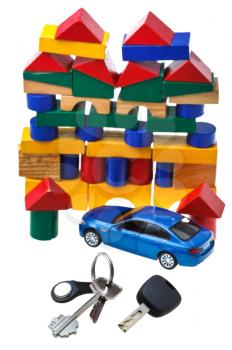 above view of door keys, vehicle key, new blue car model and wooden block toy house isolated on white background