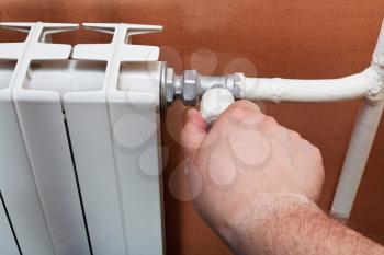 regulation of thermostat of heating radiator