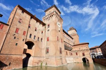 moat and The Castle Estense in Ferrara in sunny day, Italy