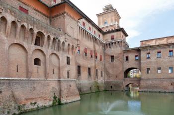 view of canal and Castle Estense in Ferrara, Italy