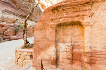 ancient niche  in sandstone mountain wall of Siq gorge, Petra, Jordan