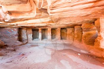 interior of ancient tomb or dwelling in sandstone cave in Petra, Jordan  