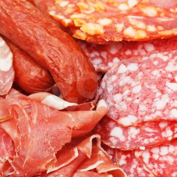 assortment of sliced meat delicacies on plate close up