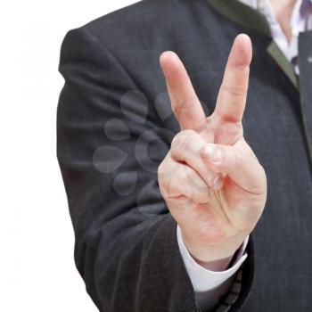 businessman shows victory sign close up - hand gesture isolated on white background