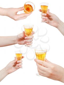 set of hand holds little glass of dessert wine isolated on white background