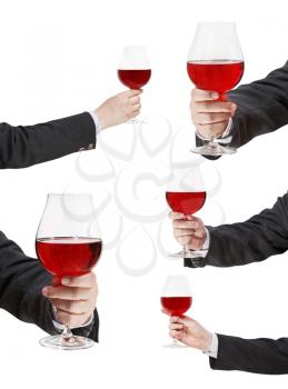 set of red wine glass in businessman hand isolated on white background