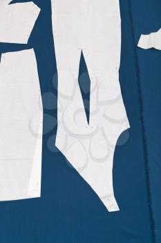 paper samples of apparel on blue fabric for dress cutting