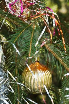yellow glass bulb christmas tree vintage decoration close up