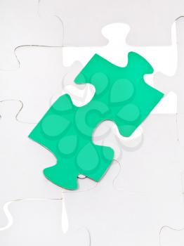 green puzzle piece on free space in layer assembled puzzles