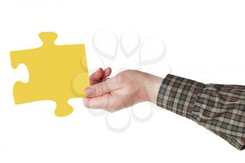 male hand with yellow puzzle piece isolated on white background