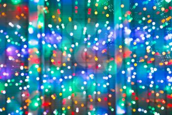 blurred christmas lights on window in night