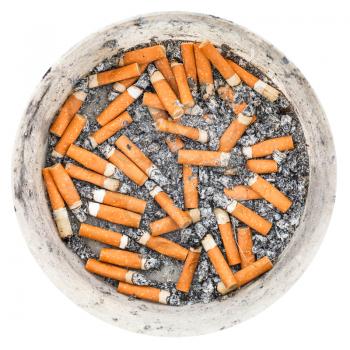 many cigarette ends in plastic ashtray isolated on white background