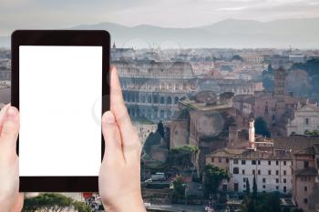 travel concept - tourist photograph road Via dei Fori Imperiali to ancient Coliseum in Rome, Italy on tablet pc with cut out screen with blank place for advertising logo