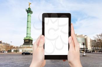 travel concept - tourist photograph Place de la Bastille and Bastille opera in Paris, France on tablet pc with cut out screen with blank place for advertising logo