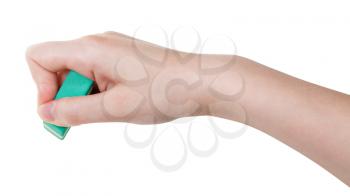 hand with green rubber eraser isolated on white background