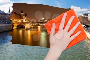 travel concept - hand deletes day view of Paris by orange cloth from image and night cityscape is appearing