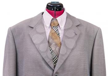 business suit on tailor mannequin - pink woolen jacket with shirt and tie close up isolated on white background