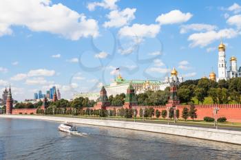 Moscow cityscape - Moscow Kremlin and embankment along Moskva River in sunny summer day