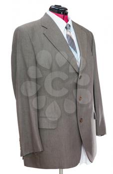 business suit on tailor mannequin - green woolen jacket with shirt and tie isolated on white background