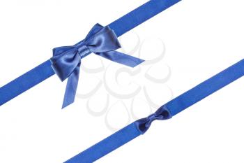 blue satin bow and knot and two diagonal ribbons isolated on horizontal white background
