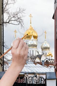 travel concept - hand paints by painbrush golden dome of russian church in autumn