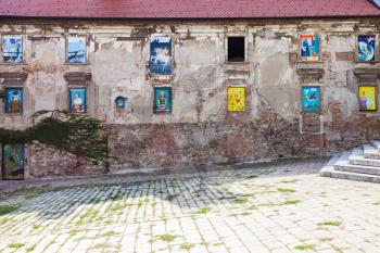 travel to Bratislava city - neglected house of the 17th century with mural paintings in windows at Rudnayovo namestie (square) in Bratislava
