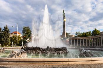 Hochstrahlbrunnen fountain and Soviet War Memorial in Vienna (Heldendenkmal der Roten Armee, Heroes Monument of the Red Army) on Schwarzenbergplatz. Memorial with Red Army Soldier was unveiled in 1945