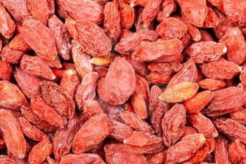 food background - dried red goji berries close up