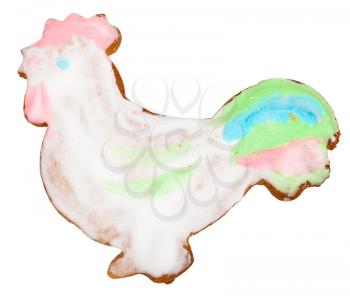 homemade Christmas festive glazed gingerbread cookie - cock figure sweet cookie isolated on white background