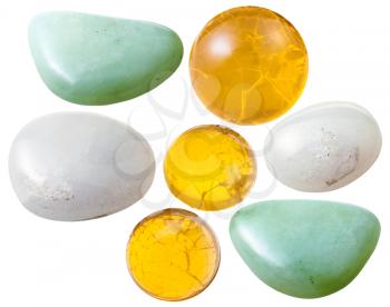 macro shooting of collection natural stones - various opal (fire, yellow, green, milky) gem stones isolated on white background