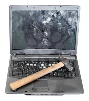 front view of old broken laptop with hammer on keyboard isolated on white background