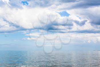 waterscape with white clouds and calm water of Sea of Azov, Temryuk bay, Golubitskaya resort, Taman peninsula, Kuban, Russia
