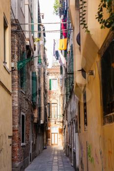 travel to Italy - narrow street in central district of Venice town (sestieri San Polo).