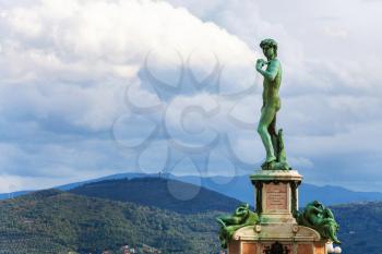 travel to Italy - Bronze statue of David facing Florence city at center of Piazzale Michelangelo. This square was designed by architect Giuseppe Poggi and built in 1869