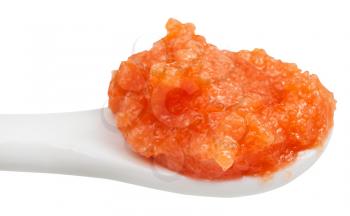 salty orange caviar of coregonus whitefish in ceramic spoon close up isolated on white background