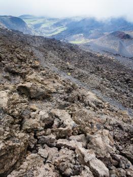 travel to Italy - slope with hardened lava field on Mount Etna in Sicily in summer day