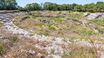 travel to Italy - roman Amphitheater (Anfiteatro romano di Siracusa) in Archaeological Park (Parco Archeologico della Neapolis) of Syracuse city in Sicily