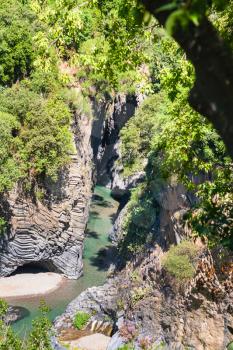 travel to Italy - above view of Alcantara river in Gole dell Alcantara in Sicily in summer day