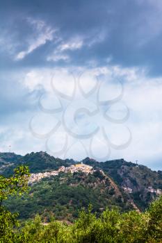 travel to Italy - rain clouds over Castiglione di Sicilia town in Sicily