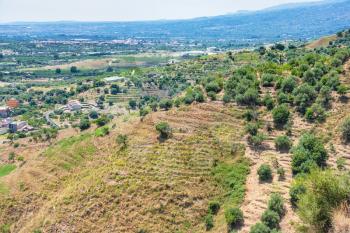 travel to Italy - green mountain slope near Calatabiano town in Sicily
