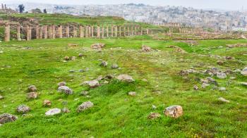 Travel to Middle East country Kingdom of Jordan - view of colonnade of Cardo Maximus road in ancient Gerasa town and Jerash city in winter
