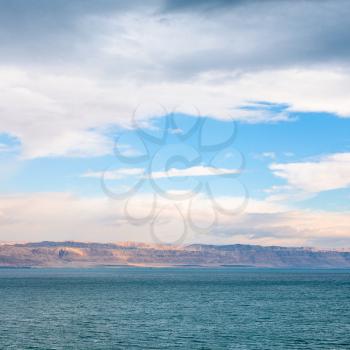 Travel to Middle East country Kingdom of Jordan - view of Dead Sea from Jordan shore on winter sunrise