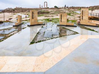 AMMAN, JORDAN - FEBRUARY 18, 2012: monuments in Amman Citadel in rainy day. Amman Citadel is a historical site in city, it is considered to be among the world's oldest continuously inhabited places