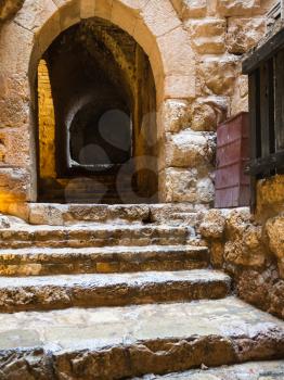 AJLOUN, JORDAN - FEBRUARY 18, 2012: wet steps in medieval Ajlun castle in Jordan in rainy winter day. Ajloun Castle is Muslim castle, it was built in northwestern Jordan in 12th century