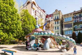 KIEV, UKRAINE - MAY 5, 2017: houses and children playground on Landscape alley in Kiev city in spring. The alley passes through the defensive shaft of Kiev of the 10th cent