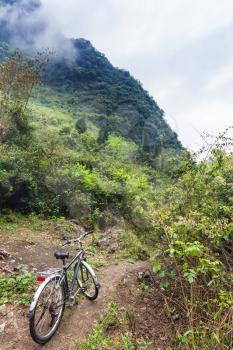 travel to China - bicycle on mountain peak slope in Yangshuo County in spring season