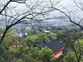 travel to China - above view of green urban garden and Guilin city in spring season