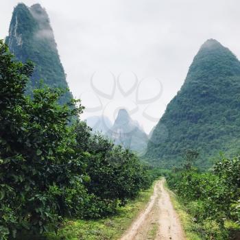 travel to China - country road between karst peaks in Yangshuo County in spring season